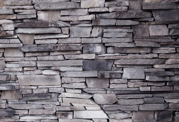 Obraz premium wall of decorative brick uneven laying of the building facade