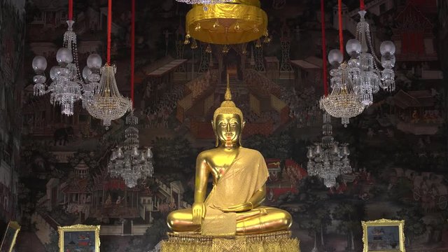 close up of gold buddha in the ordination hall of wat arun temple in bangkok, thailand