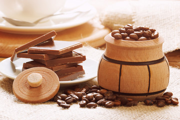 Coffee beans in decorative barrel with chocolate