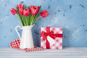 Red tulip flowers and gift box