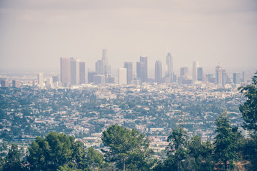 Obraz premium City panorama of Los Angeles and Griffith Park. Smog over the city