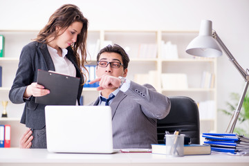 Sexual harassment concept with man and woman in office