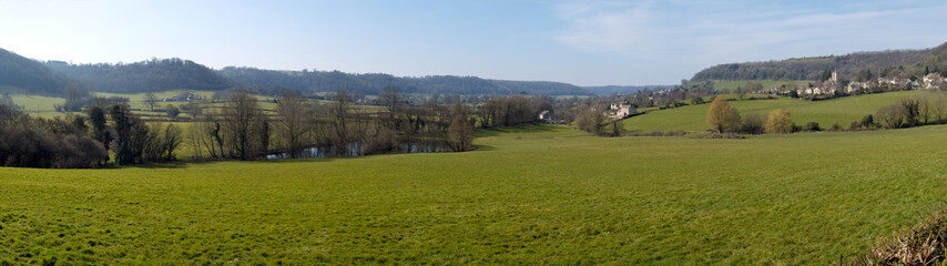 Picturesque Uley village on the edge of the Cotswold Hills escarpment in spring sunshine, Gloucestershire, UK.