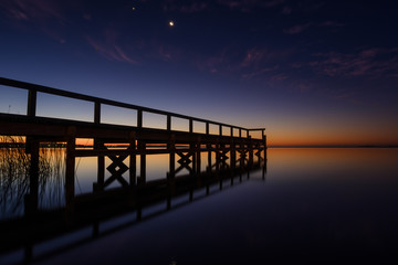 Fototapeta na wymiar Sunset pier at lake Jindabyne, Australia