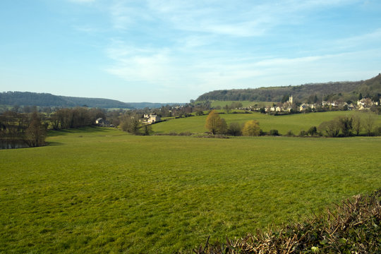 Picturesque Uley village on the edge of the Cotswold Hills escarpment in spring sunshine, Gloucestershire, UK.