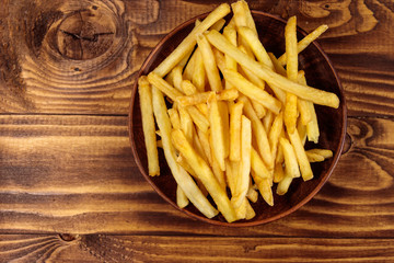 French fries on wooden table