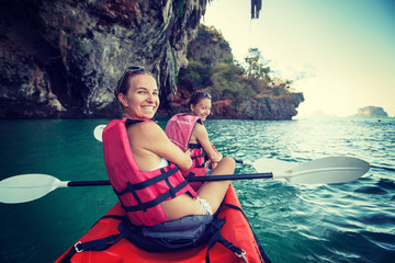 Women are kayaking in the open sea at the Krabi shore, Thailand