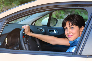 Fototapeta na wymiar young woman parking car .Learning to drive