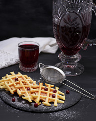 baked waffles and compote in a glass