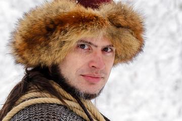Portrait strong viking warrior winter woods battle scandinavian traditional clothing lumberjack...