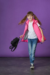 Fashion pretty model teenager. Portrait of stylish young kid clothes. Hipster girl teen smiles.