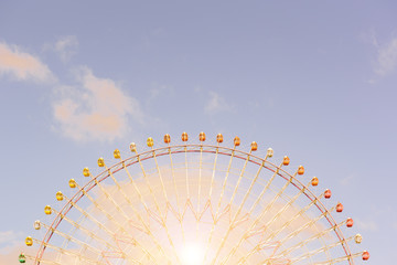 Colorful of Giant Ferris Wheel In the interval before sunrise and sunset at Osaka, Japan