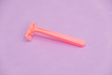 pink women's disposable razors . Hygiene skin body care concept. Hair removal. Focus on razor.