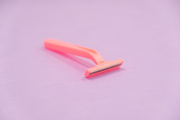 pink women's disposable razors . Hygiene skin body care concept. Hair removal. Focus on razor.