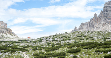 view of the Dolomites, Alps, with refuge among the rocky peaks