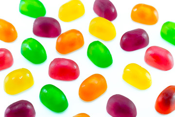 Fruit gummi or jelly candies assortment on white