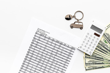 Car credit concept. Money and calculator near car silhouette on white background top view copy space