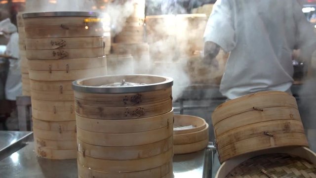 Bamboo steamers at Chinese kitchen , slow motion