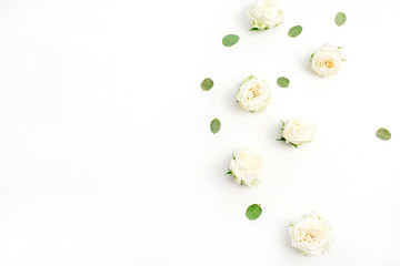Fototapeta na wymiar White rose flower buds on white background. Fat lay, top view.