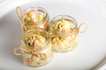 Russian salad in the glass can