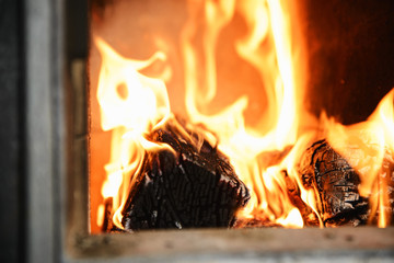 Red-yellow flames in the furnace of the old furnace