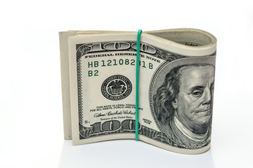 100 dollars isolated on a white background , close up .