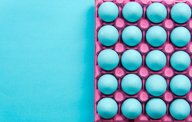 Pastel blue eggs in pinky tray
