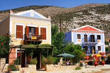 Traditional houses by the harbour of the town of Kastellorizo, Kastellorizo island, Dodecanese islands, Greece.