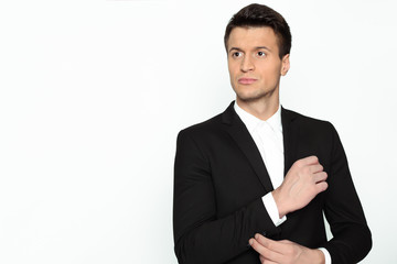 Smiling modern beautiful confident businessman in smart casual wear looking at the camera on a white background.