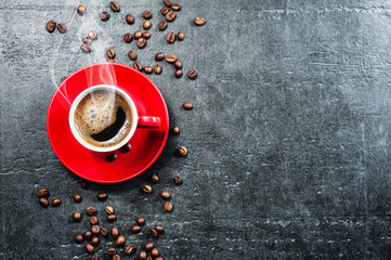 Coffee cup background with coffee beans top view.