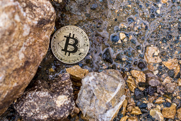 bitcoin on the stone background