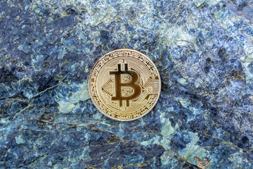 bitcoin on the stone background