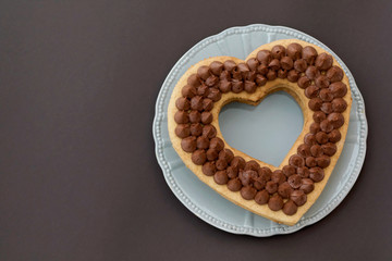 Chocolate cake in shape of heart on Valentine's Day or Woman's day. Place for text.