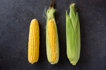 Fresh corn, Fresh corn on cobs on table closeup. © luckybusiness