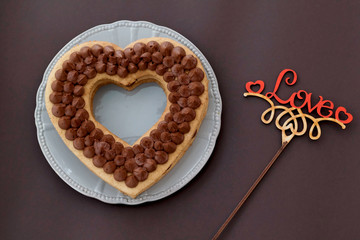 Chocolate cake in shape of heart on Valentine's Day or Woman's day. Love concept.