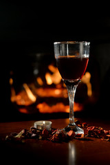 Romantic scene with wine Glass and Fireplace 