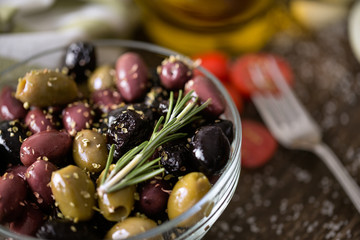 mix of olives in oil with spices.