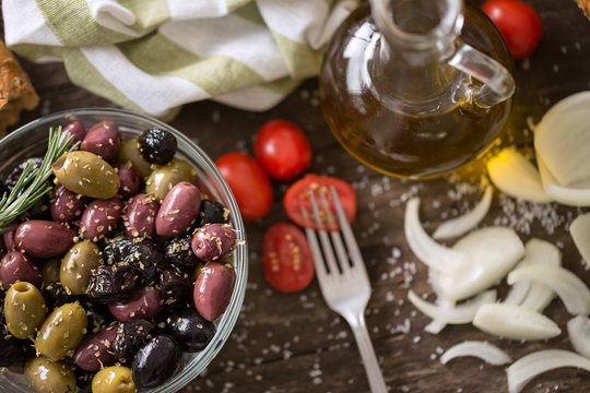 Mediterranean mix of olives for salad in oil .