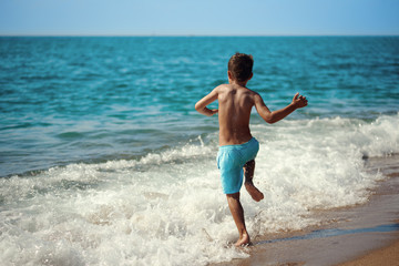 Caucasian boy against the sea.
