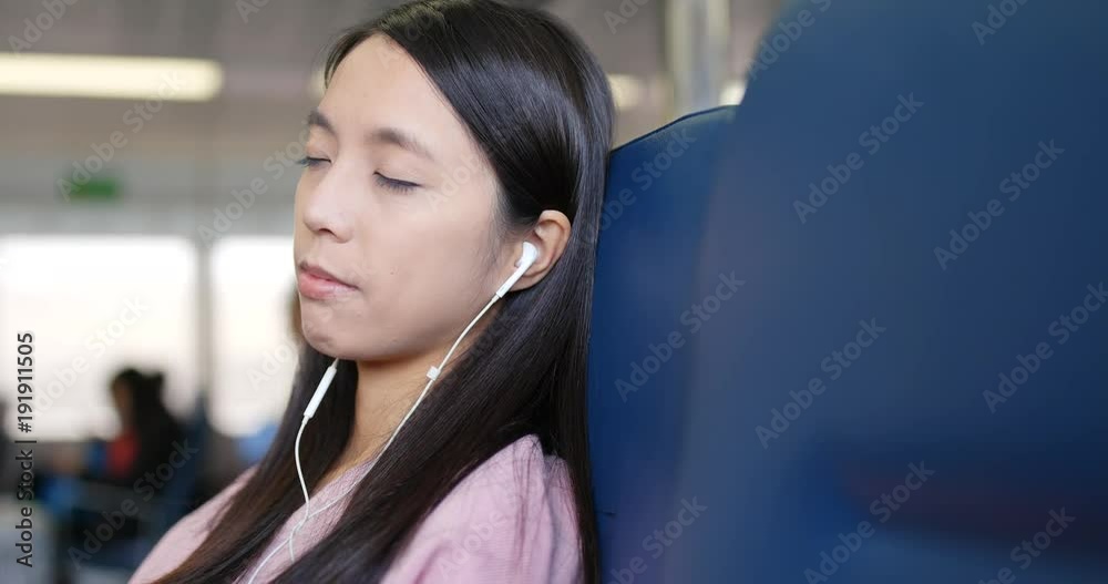 Canvas Prints woman listen to music and sleep on ferry