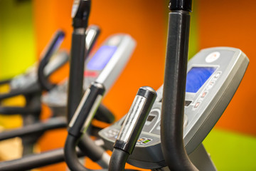 Fitness machines in a fitness club or gym. Selective focus.