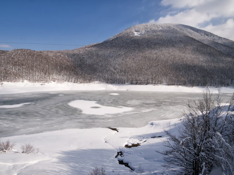 Frozen lake, Passi Lagastrello in the Italian Appennine mountains.
