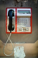Retro red phone booth box close up, isolated  on sunny day technology of 20th century 
