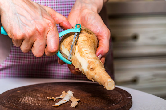 Hands Peeling Parsnip Close