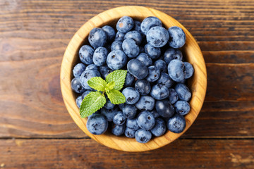 ripe  bog whortleberry in a wooden plate