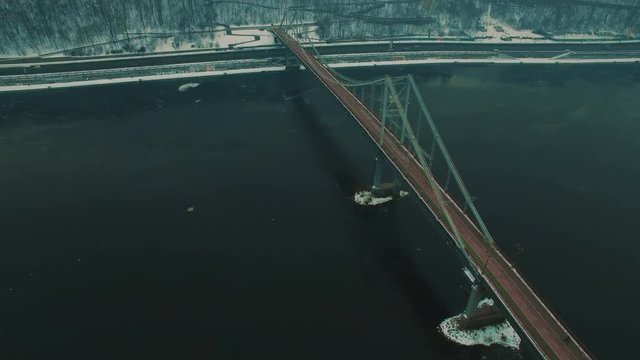 Bridge under river.Grey foggy winter day.Aerial drone footage