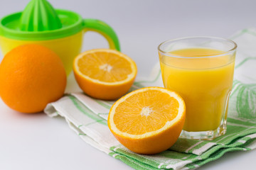 Fresh citrus fruit Juice on the white table Citrus press