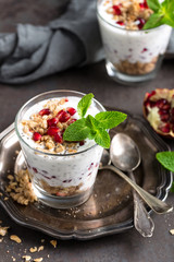 Chia pudding parfait with pomegranate, granola and light greek yogurt. Healthy eating