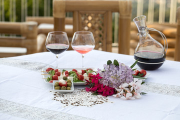 Table on the terrace prepared for a romantic dinner
