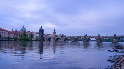Vltavar river with Charles bridge , early morning with blue purple sky